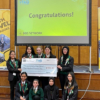 Youth Travel Ambassadors present the £500 cheque awarded for their Active Transport Project in March 2023