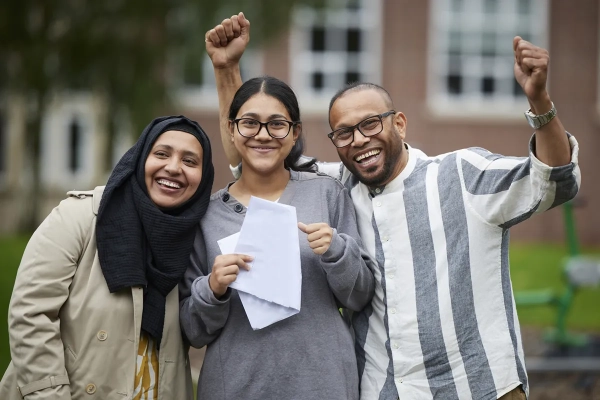 Student celebrates with her family on GCSE Results Day 2023
