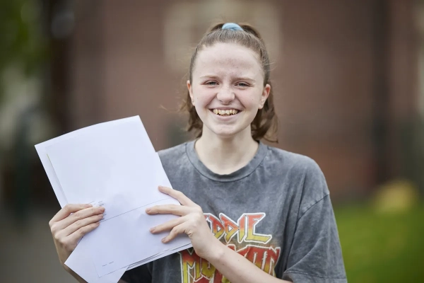 Student celebrates her results on GCSE Results Day 2023